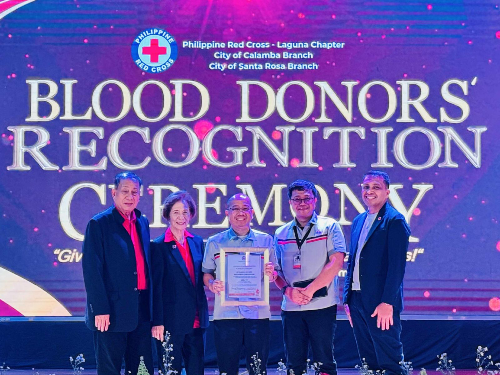 In Photo: MMPC Vice President for Safety, Health & Environment under the Manufacturing Division Marfel Ancheta (center) and MMPC Manufacturing Assistant Manager Von Karlo Divinagracia receiving the Blood Services Platinum Award from representatives of the Philippine Red Cross.