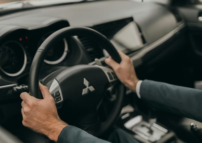 man driving mitsubishi
